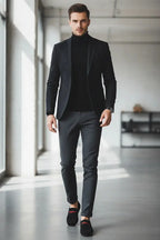 Model wearing black loafers